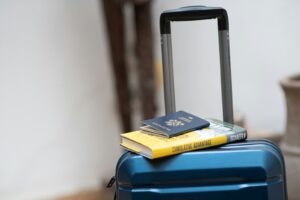 Suitcase with books resting on top